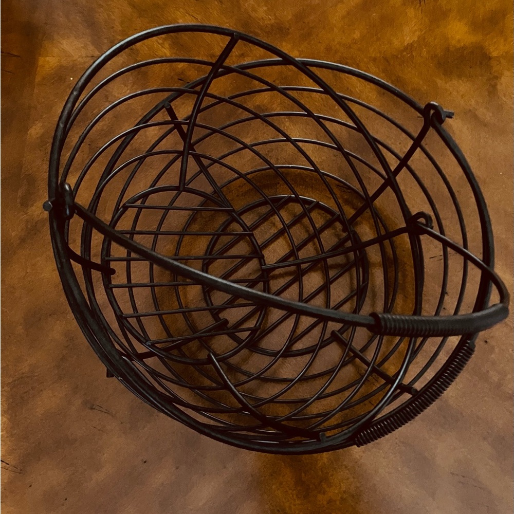 Lot of 2 Black Wire Basket. Diameter on top is approximately 11 1/2”
